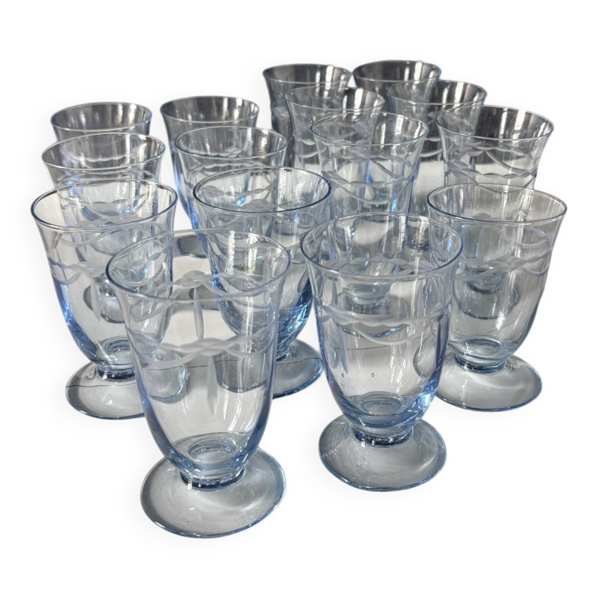 Set of 32 vintage glacier blue engraved stemmed glasses.
