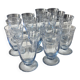 Set of 32 vintage glacier blue engraved stemmed glasses.