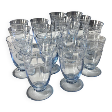 Set of 32 vintage glacier blue engraved stemmed glasses.