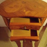 Louis XV style bedside table with varnished marquetry.