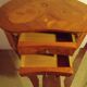 Louis XV style bedside table with varnished marquetry.