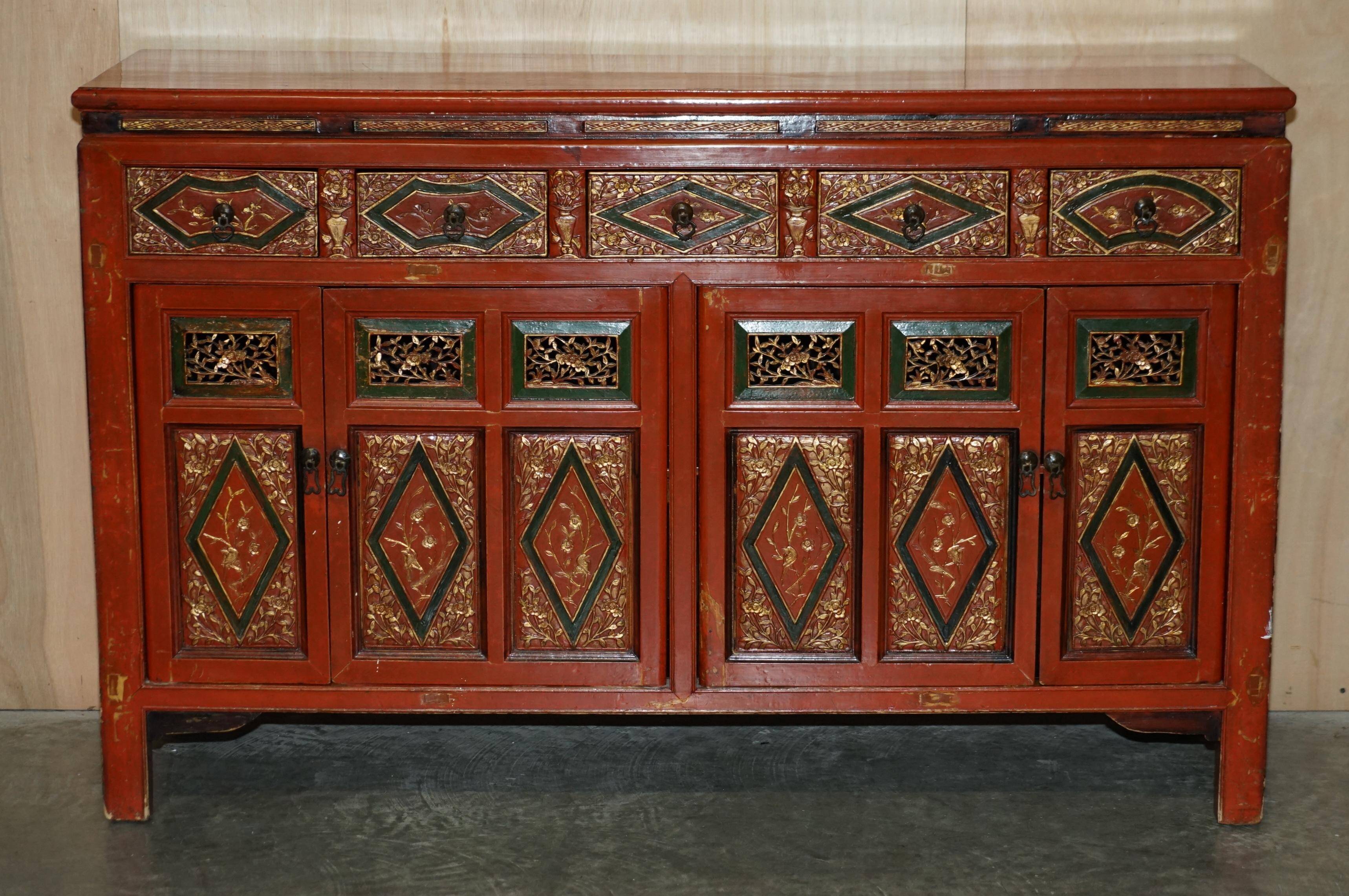 Vintage Chinese lacquered buffet decorated with gold leaf.
