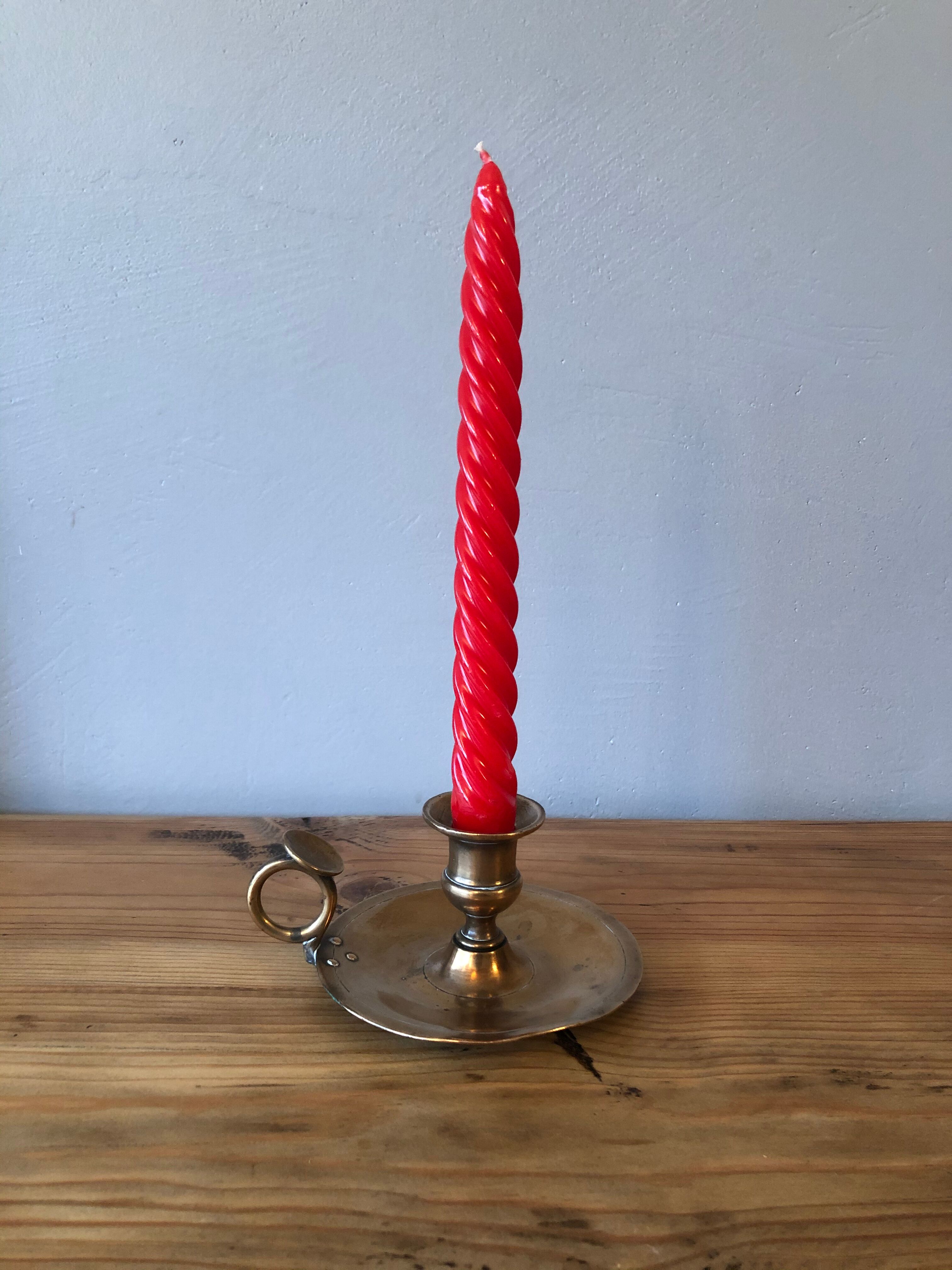 Old copper hand-held candlestick