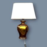 Large Deknudt lamp in varnished gold brass, 1970s.
