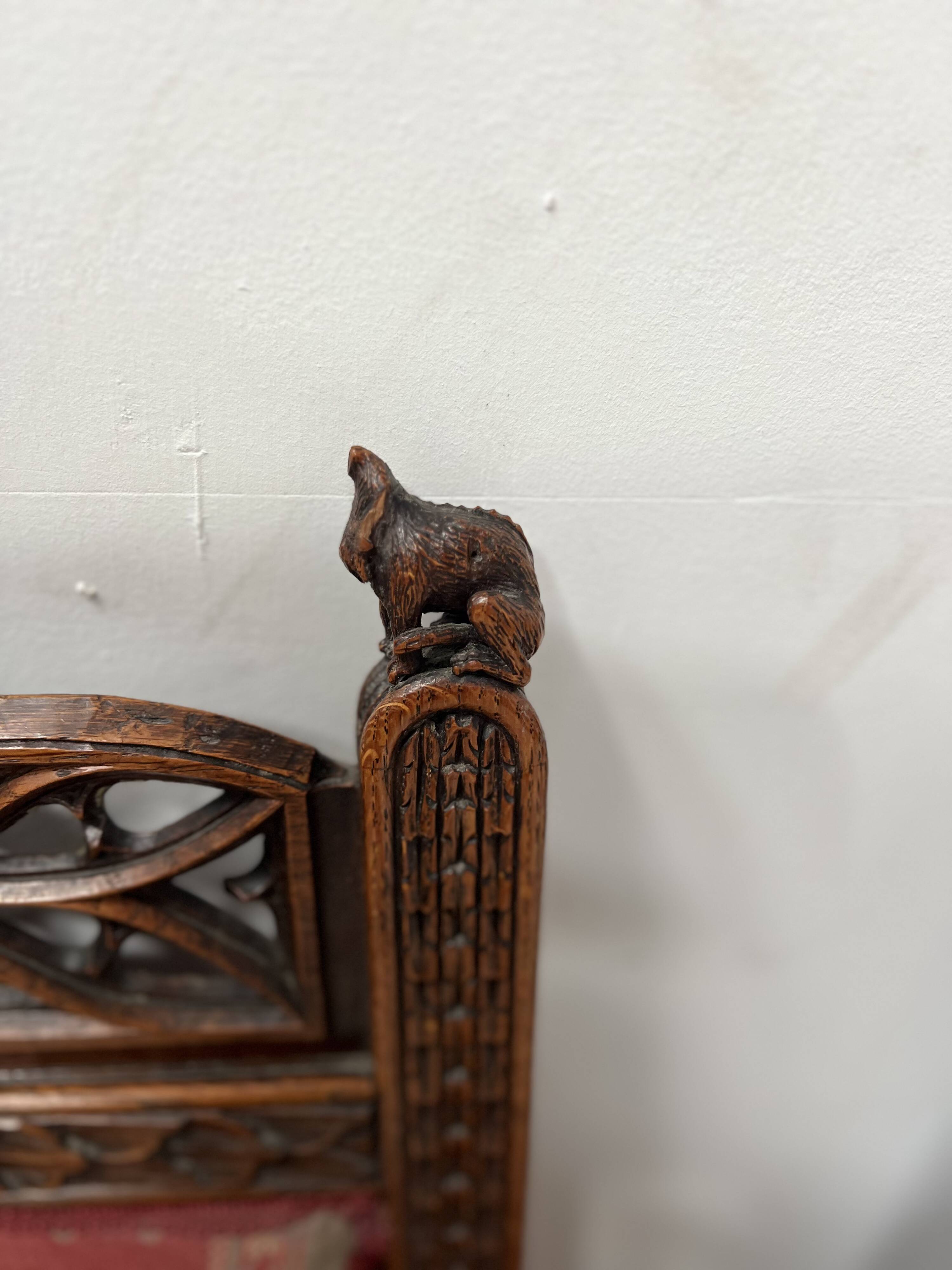 Pair of Gothic-style walnut lounge chairs, 19th century