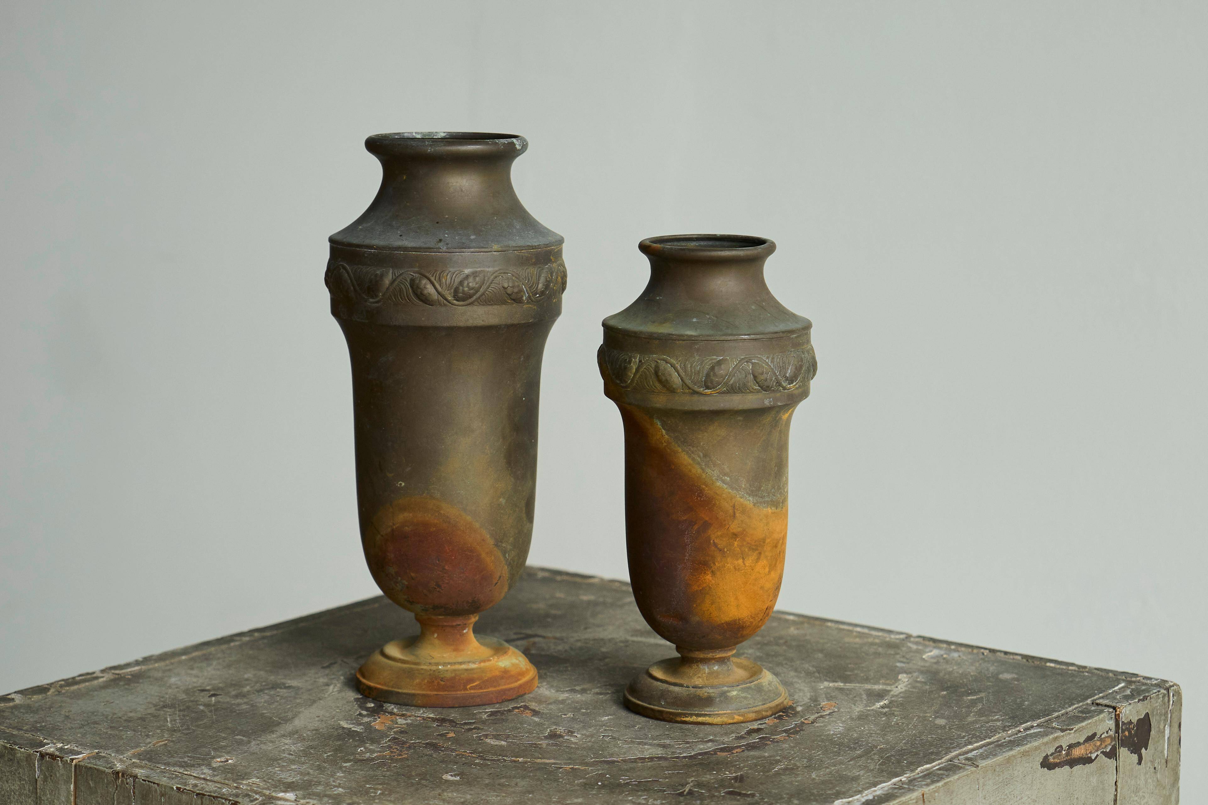 Pair of Art Deco vases in patinated metal