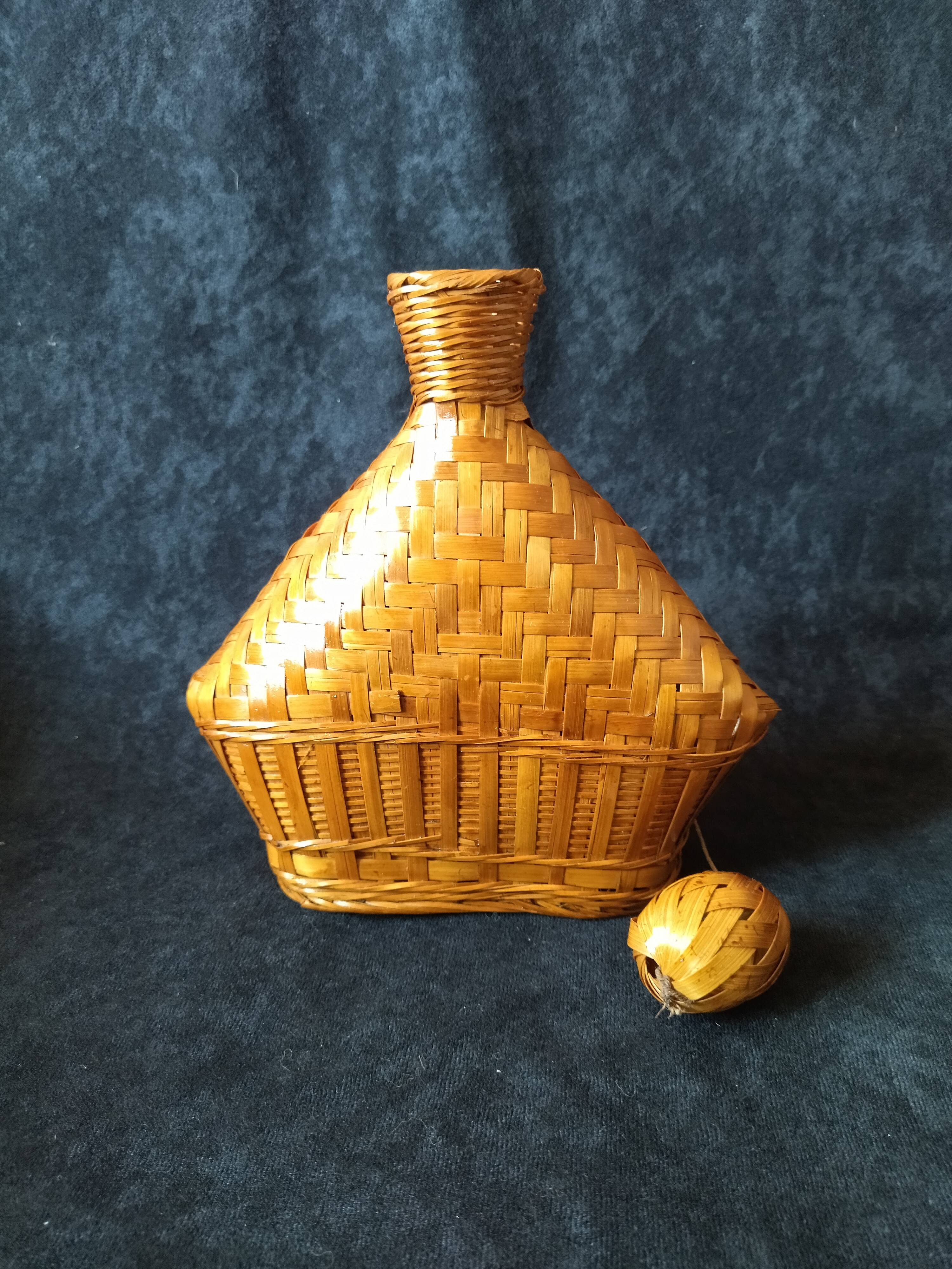 Vintage wicker and braided bamboo bottle
