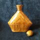 Vintage wicker and braided bamboo bottle