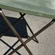 Folding garden or bistro table in khaki sheet metal from the early 1950s.