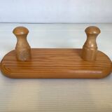 Small wooden coat rack with two hooks