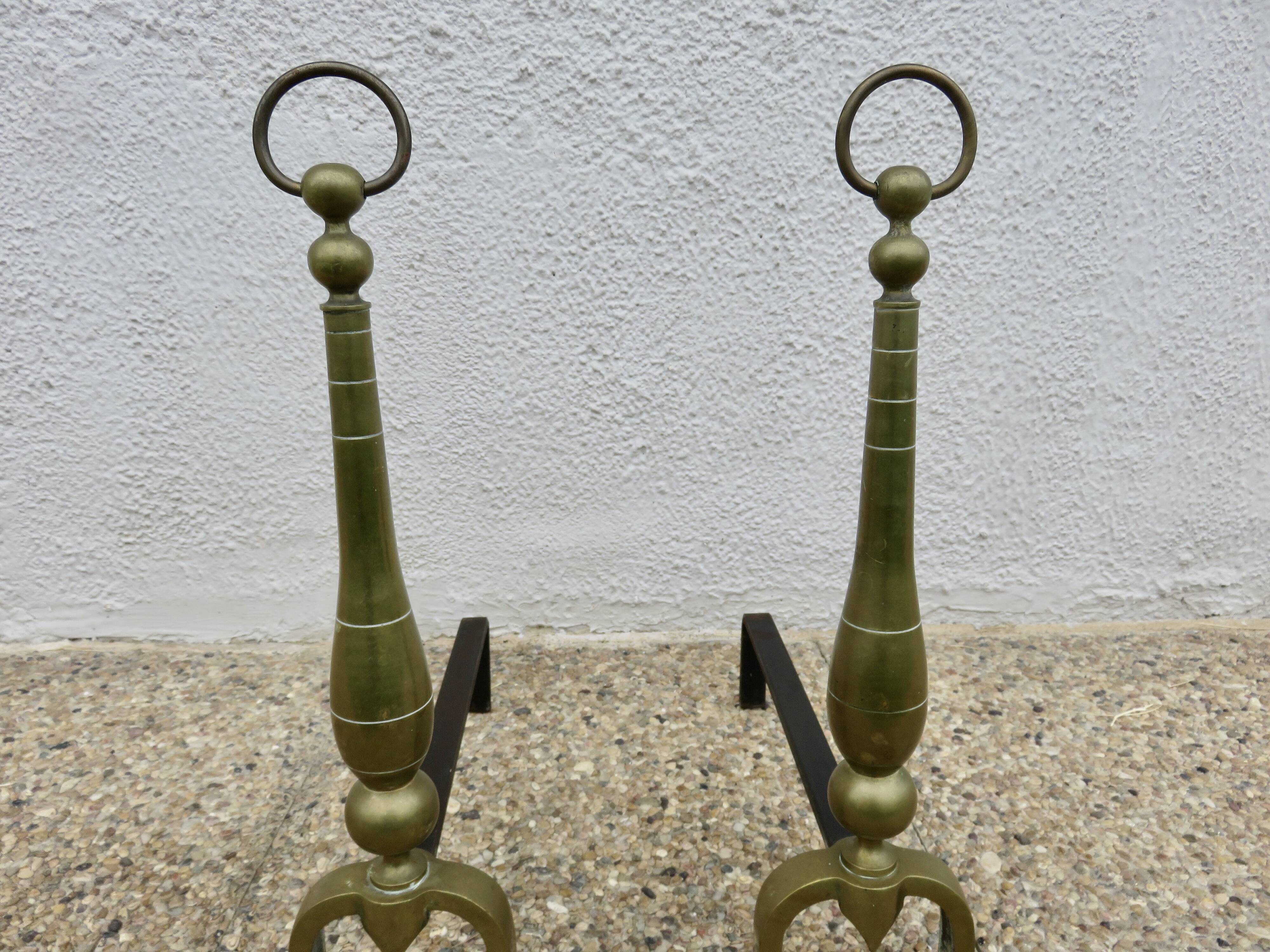 Pair of Neo-classical andirons, in solid bronze, 1920s-1930s.