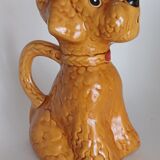 Ancient ceramic pitcher in the shape of a poodle.