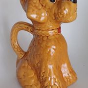 Ancient ceramic pitcher in the shape of a poodle.
