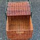 Metal chest of drawers and four woven wicker baskets