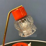 Small orange desk lamp with clear crystal glass shade