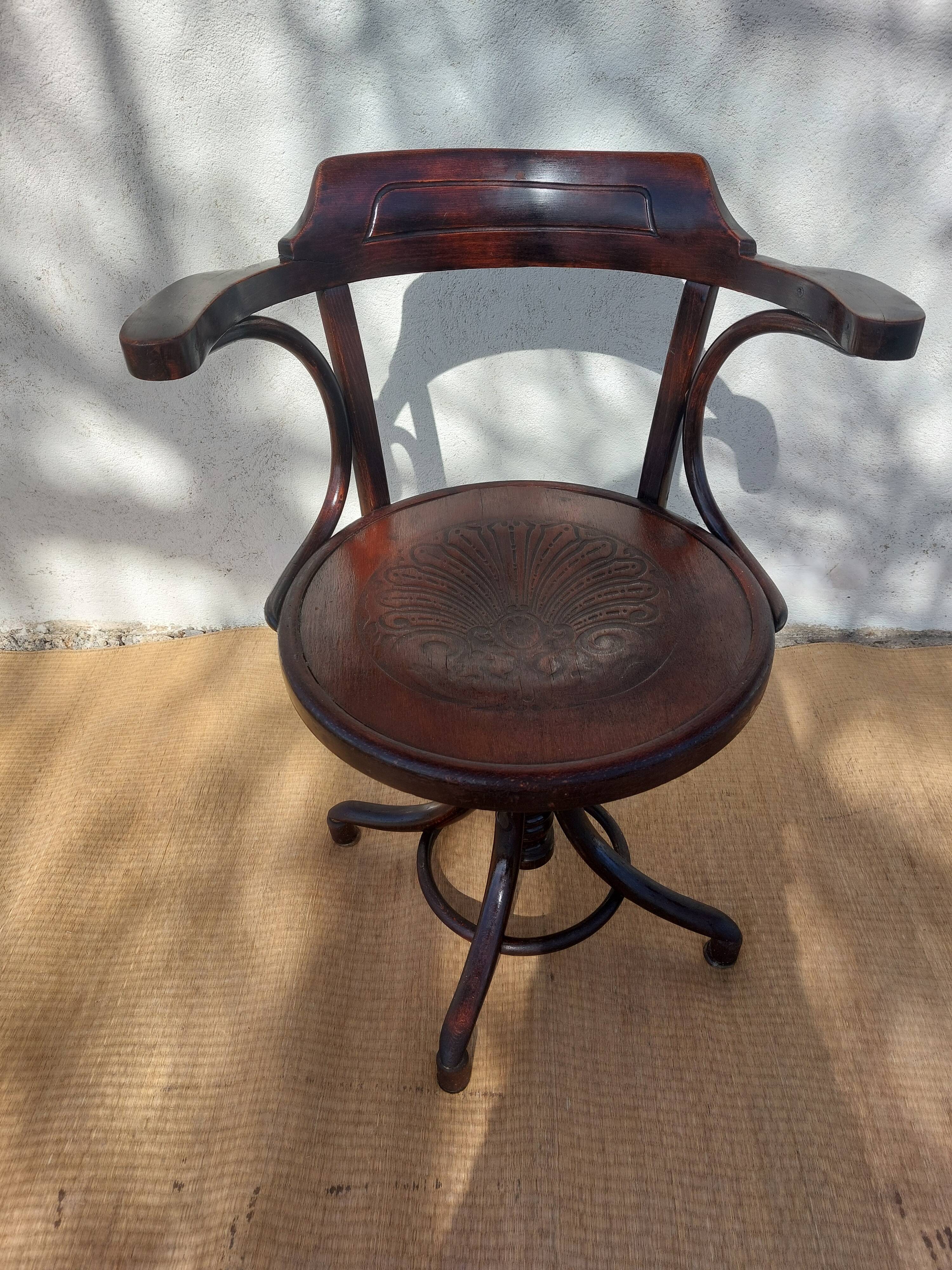 Swivel wooden armchair, pattern on seat