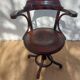 Swivel wooden armchair, pattern on seat