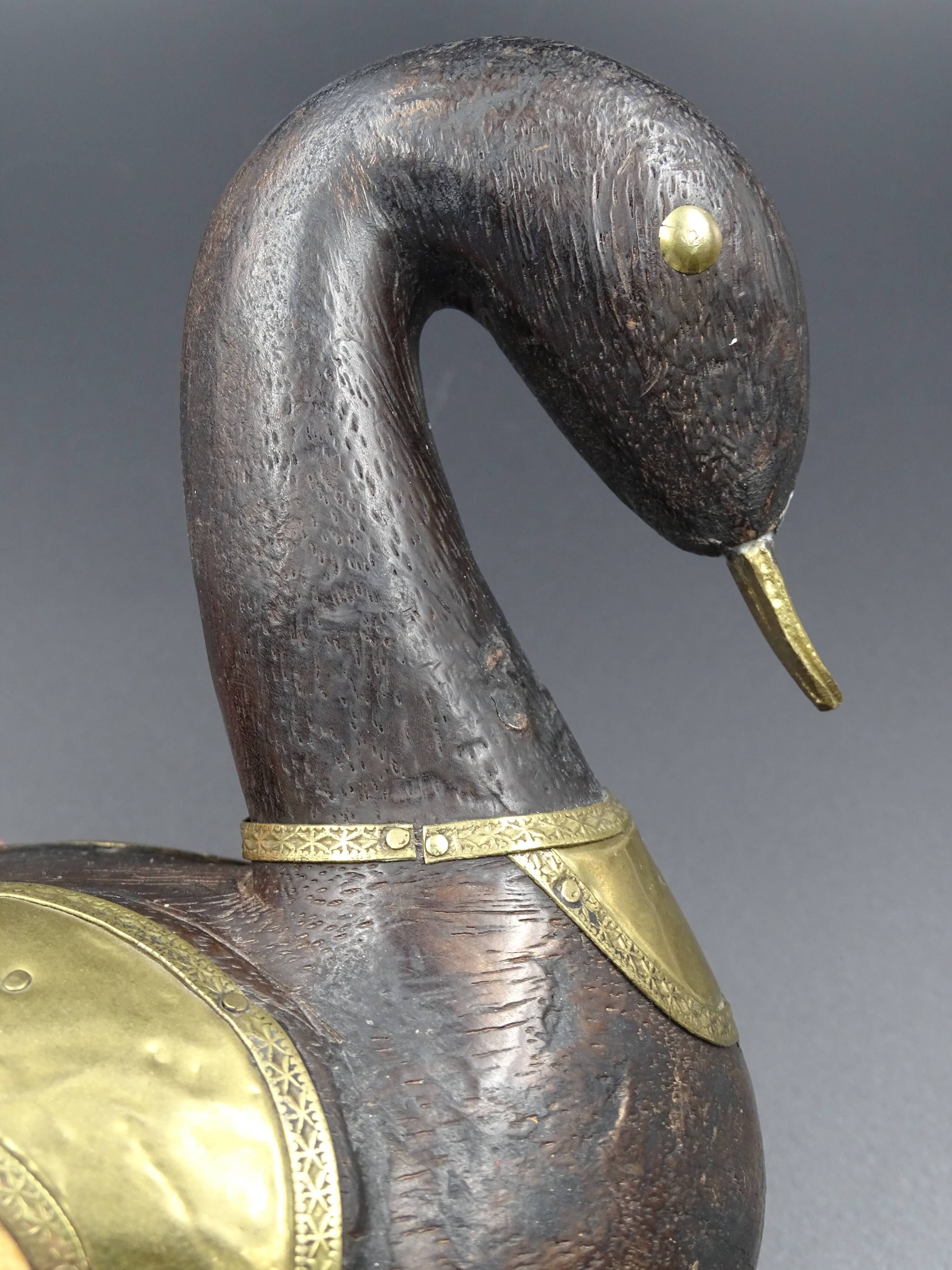 Wooden and brass swan