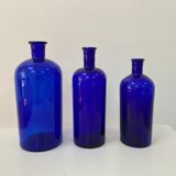 Trio of apothecary bottles in cobalt blue glass