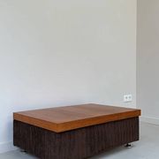 Coffee table with brown corduroy fabric, wooden top and chrome legs