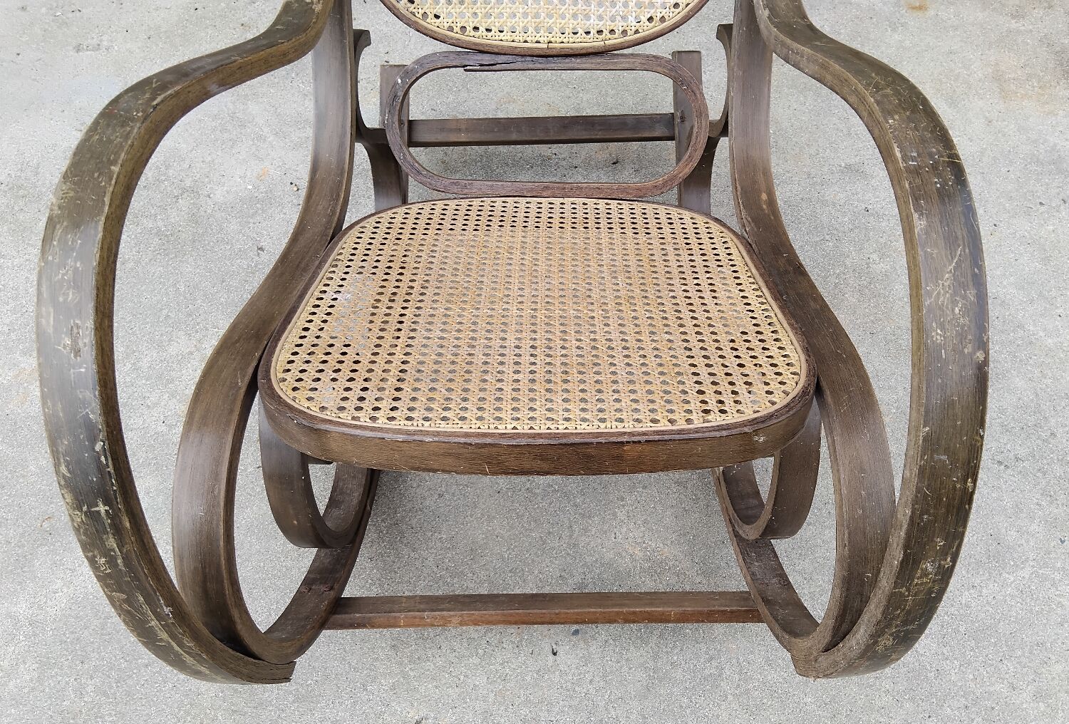 Vintage wooden and cane rocking chair
