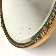 Miroir biseauté antique avec cadre en métal doré
