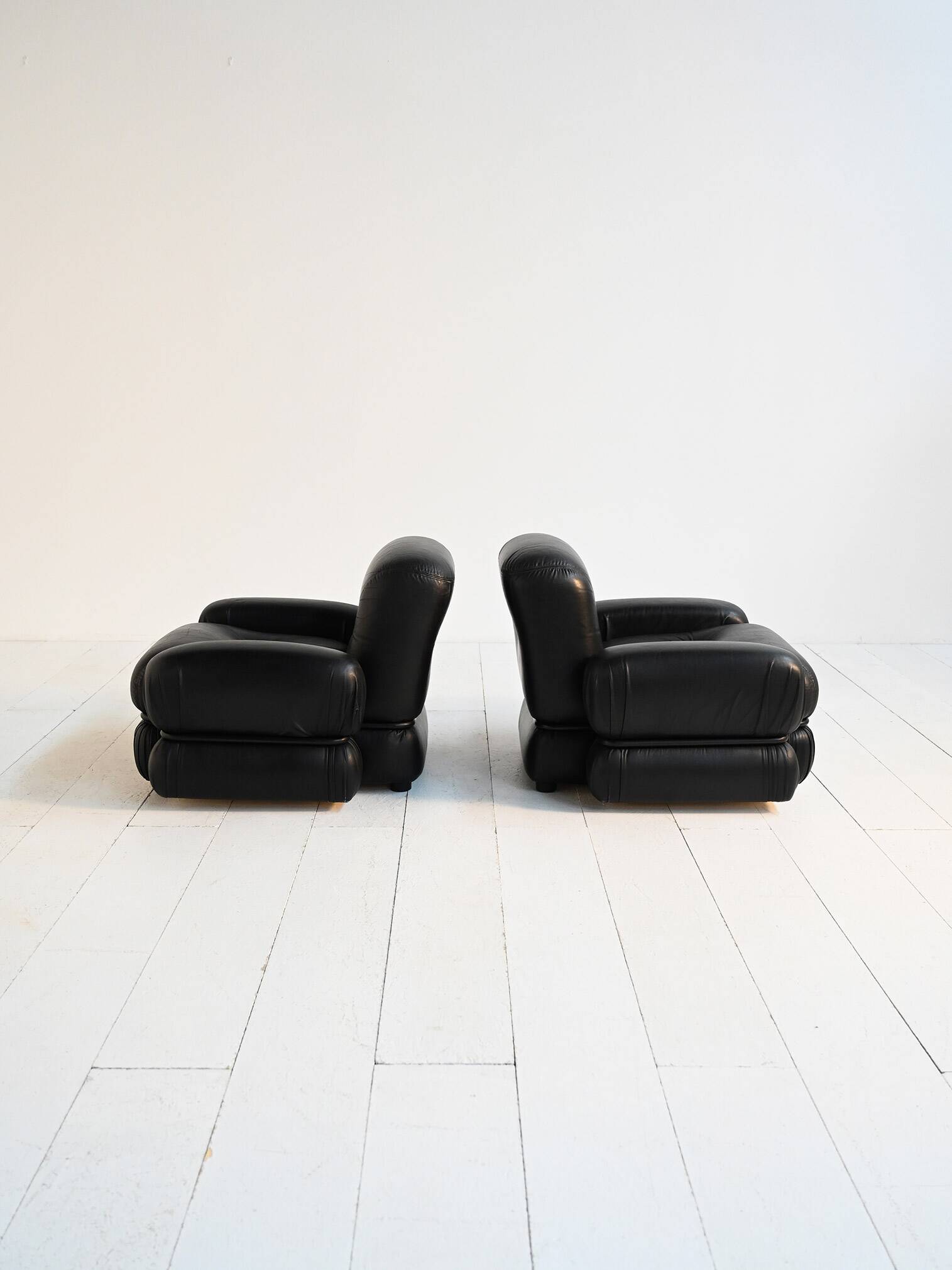 Black leather and tubular steel armchairs, 1970s