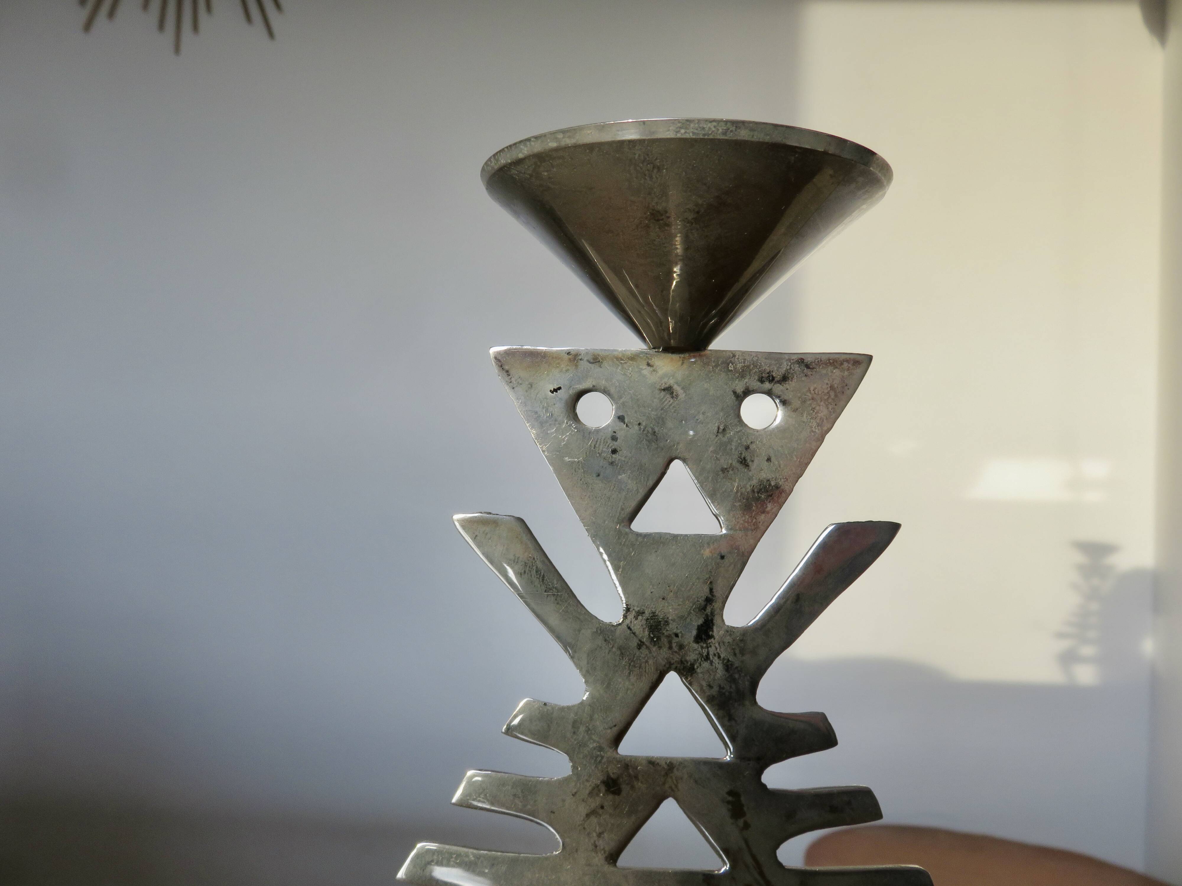 Ethnic “skeleton” candle holder in nickel-plated brass from the 80s