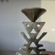 Ethnic “skeleton” candle holder in nickel-plated brass from the 80s