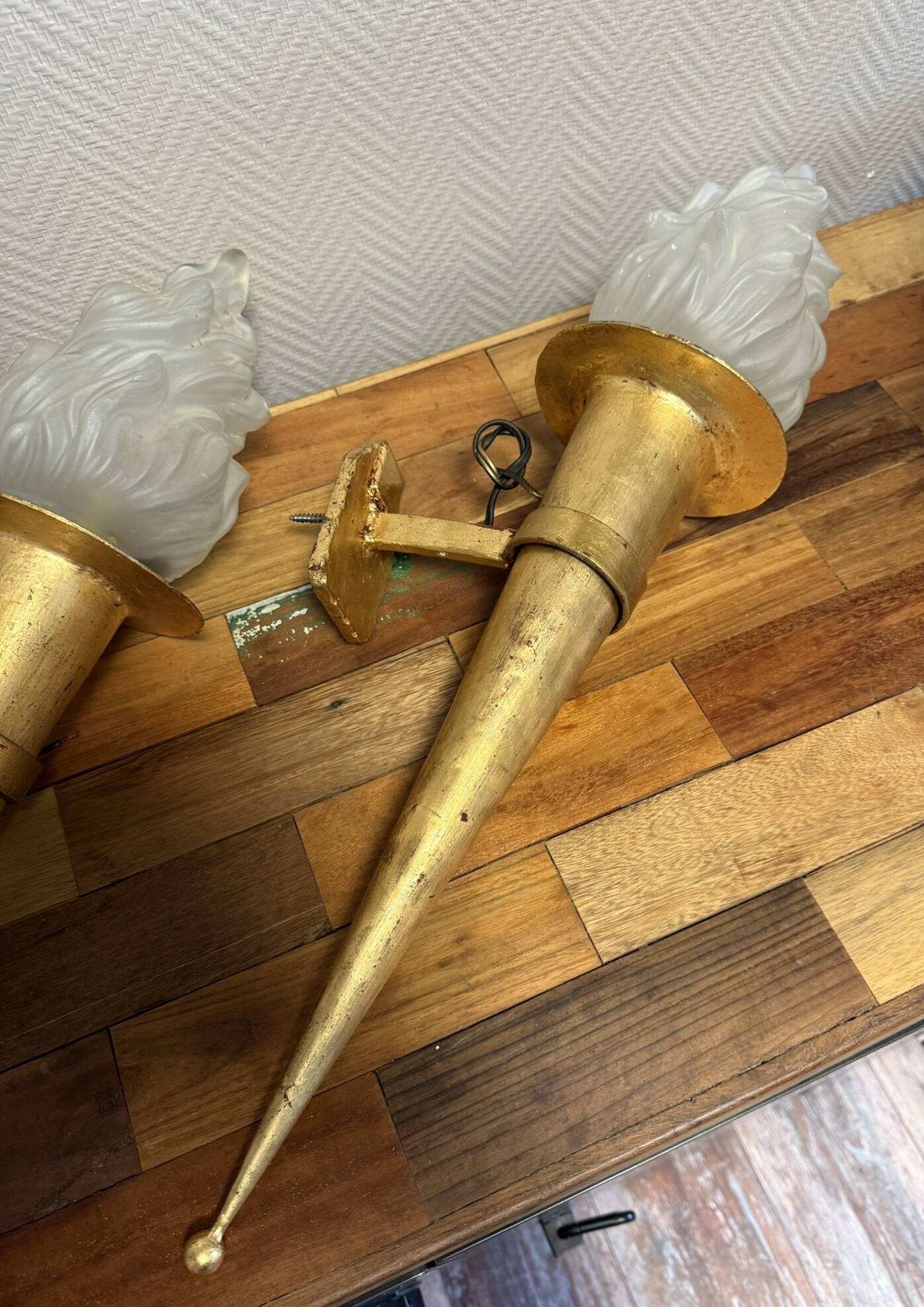 Pair of large medieval-style torchiere lamps in gilded metal