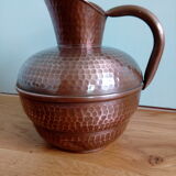 Dented copper vase or jug