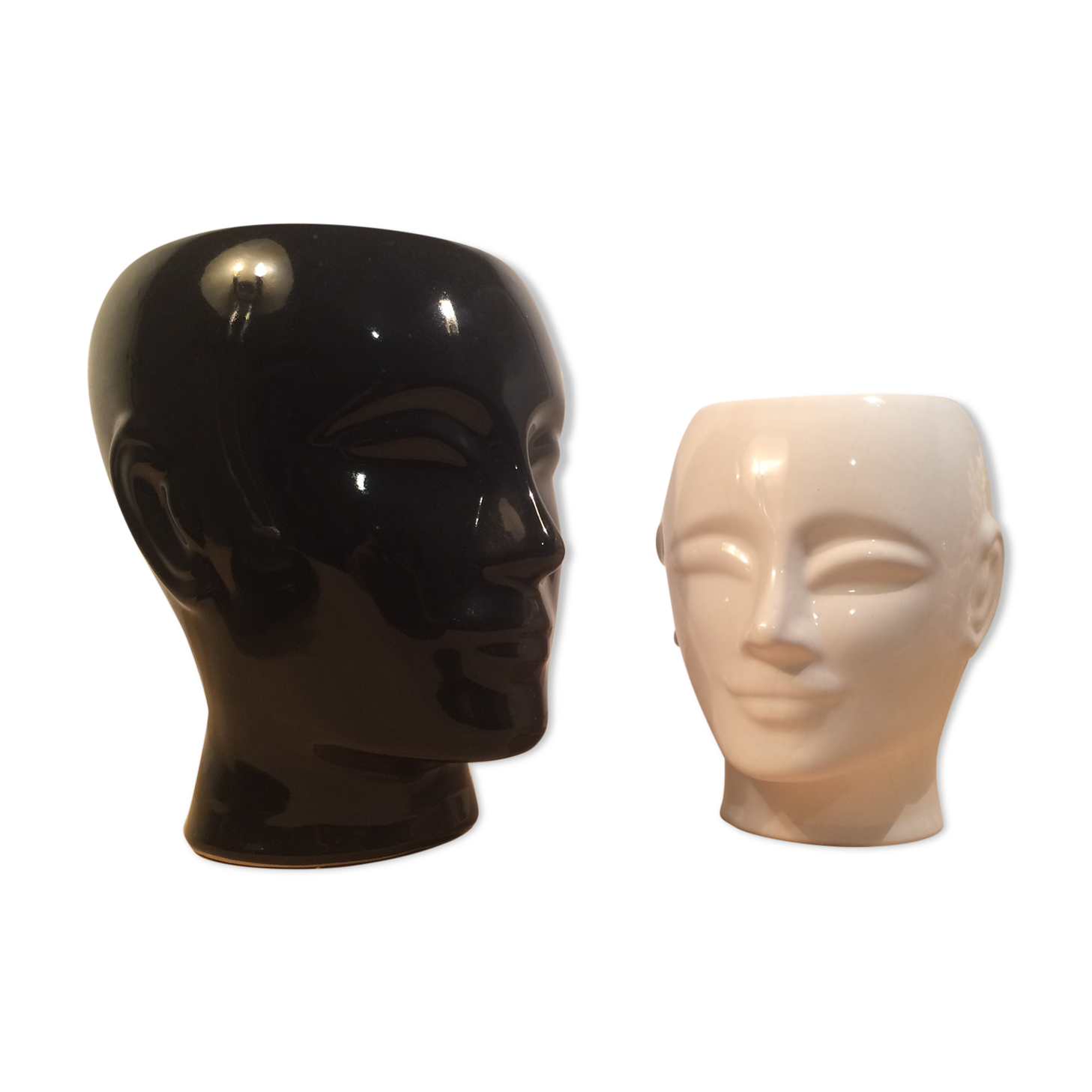 2 black and white ceramic head vases, face