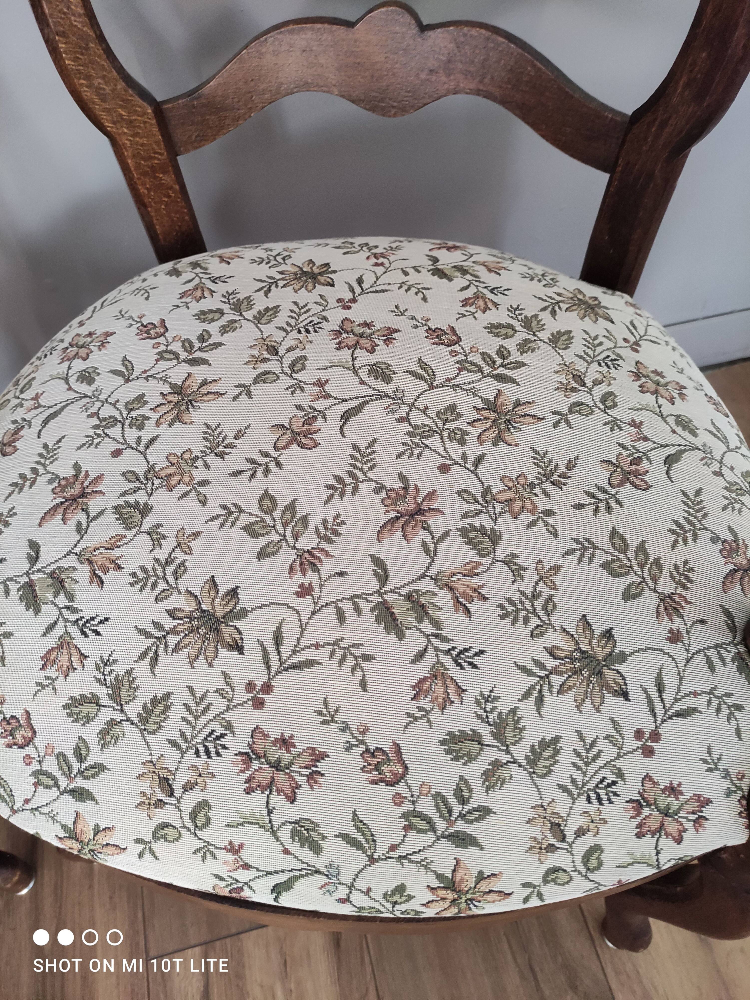 Pair of Provencal armchairs in brown wood and floral fabric