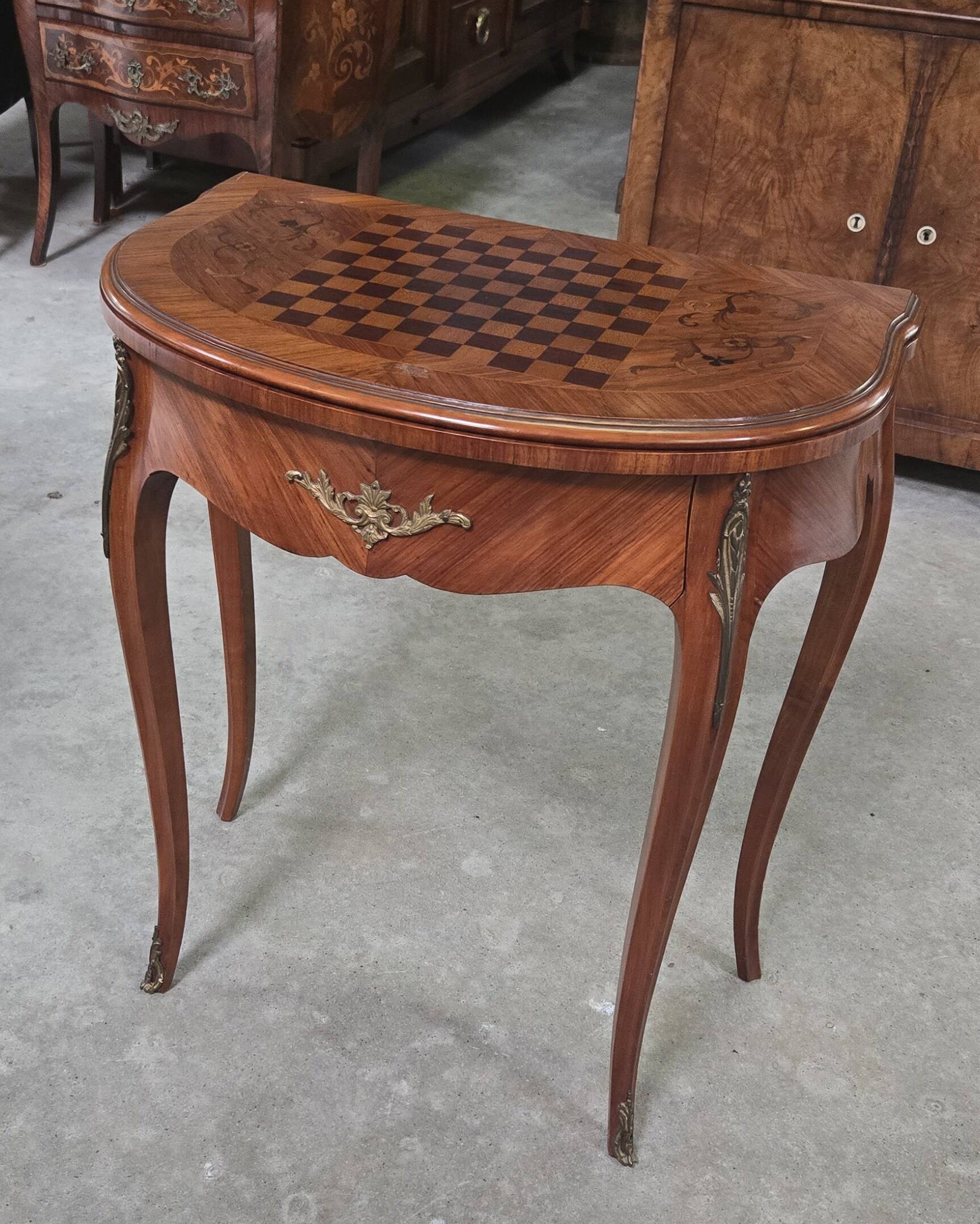 Half-moon gaming table in Louis XV style, made of precious wood marquetry.