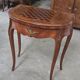 Half-moon gaming table in Louis XV style, made of precious wood marquetry.