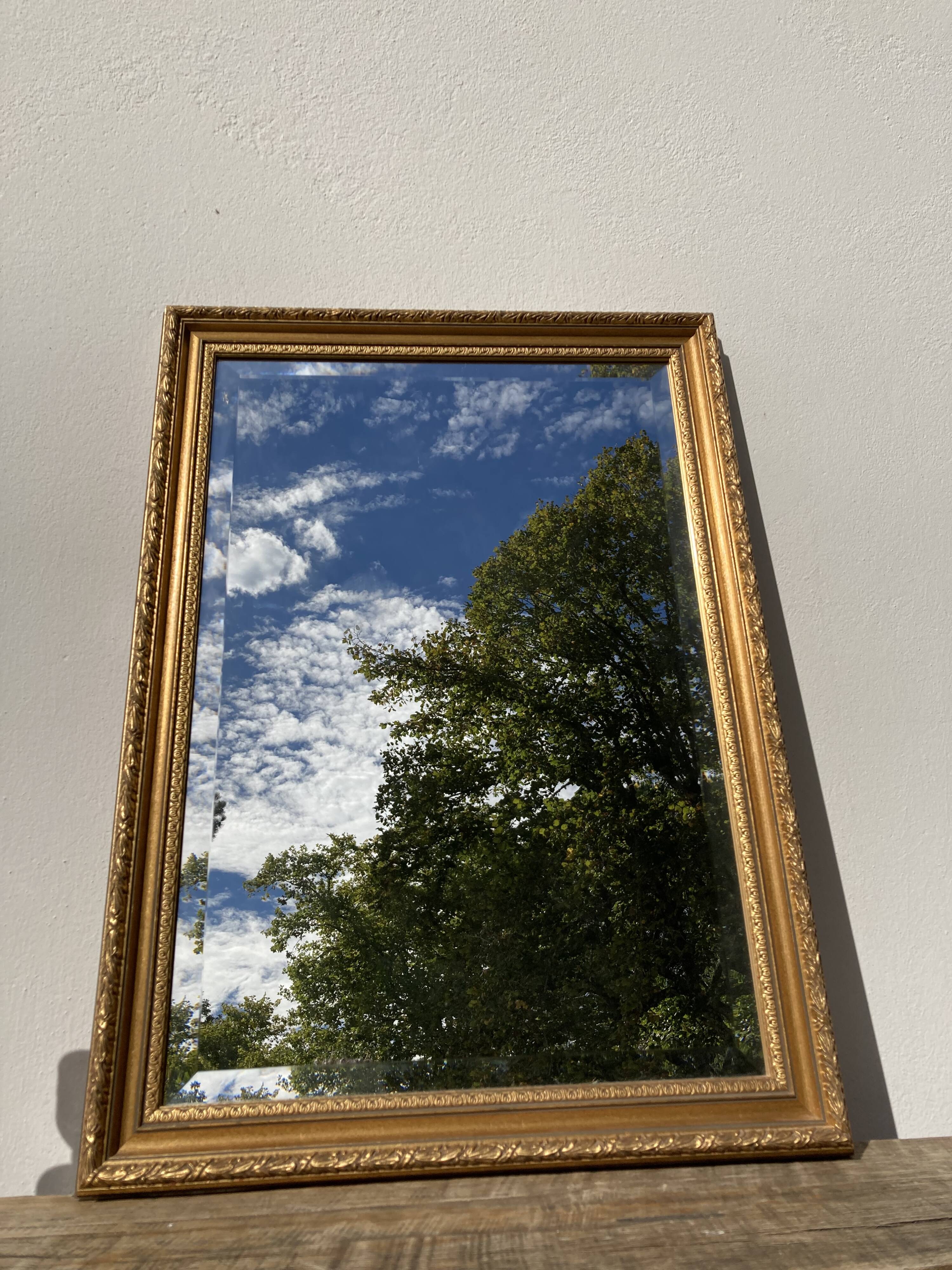 Antique mirror in rectangular beveled gilded wood in Louis XVI style