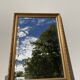 Antique mirror in rectangular beveled gilded wood in Louis XVI style