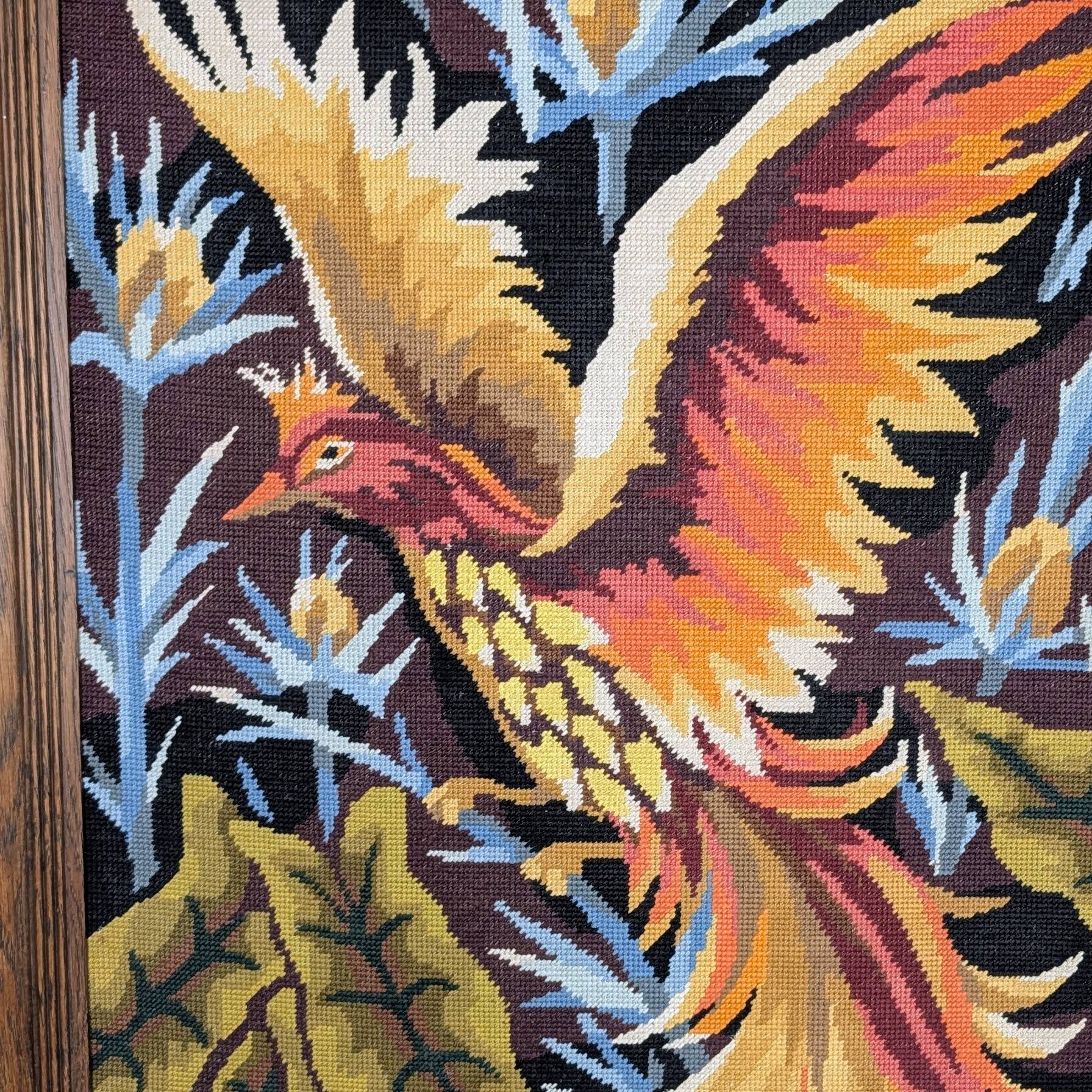 Framed embroidered canvas of a firebird.