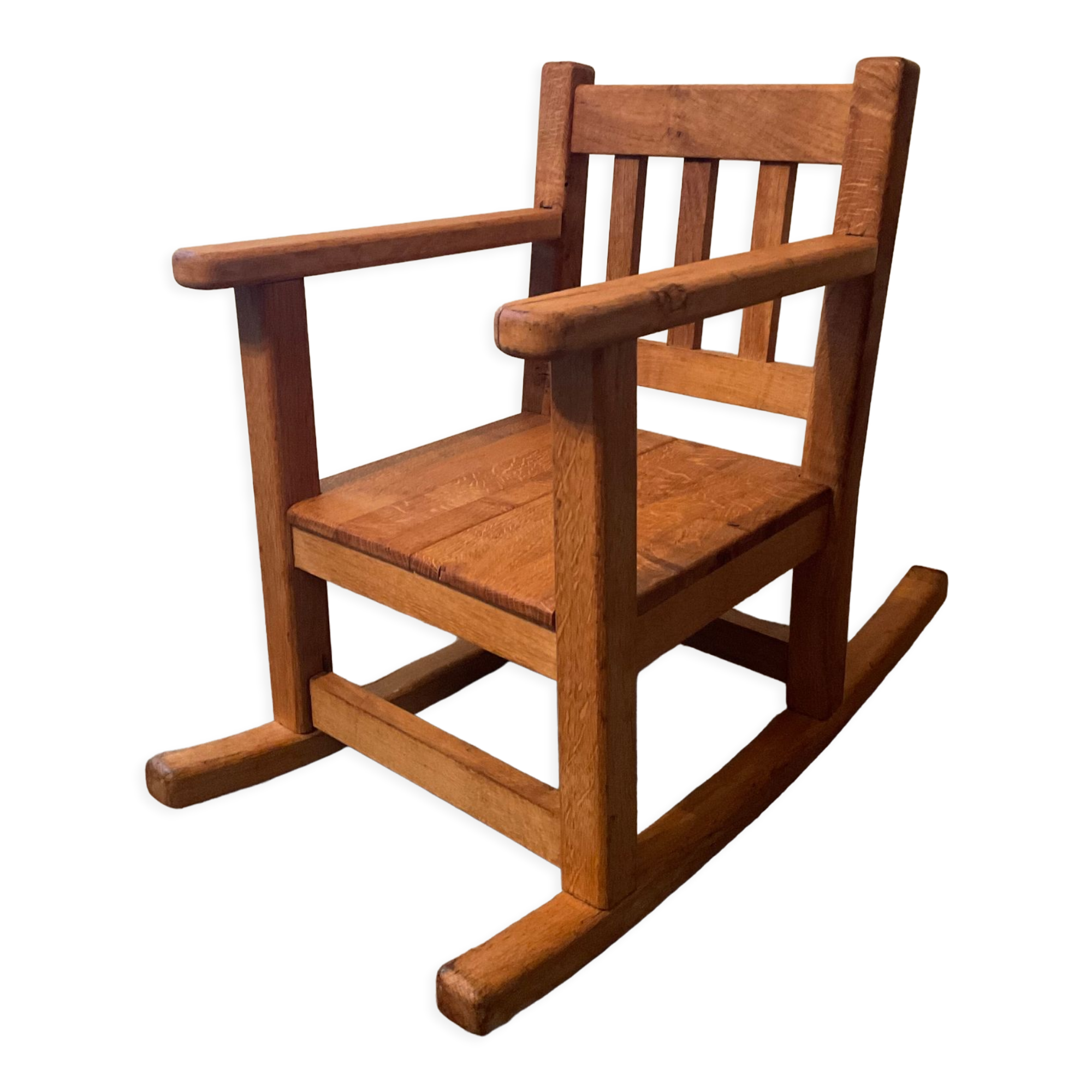 Old children's rocking chair in solid wood