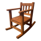 Old children's rocking chair in solid wood