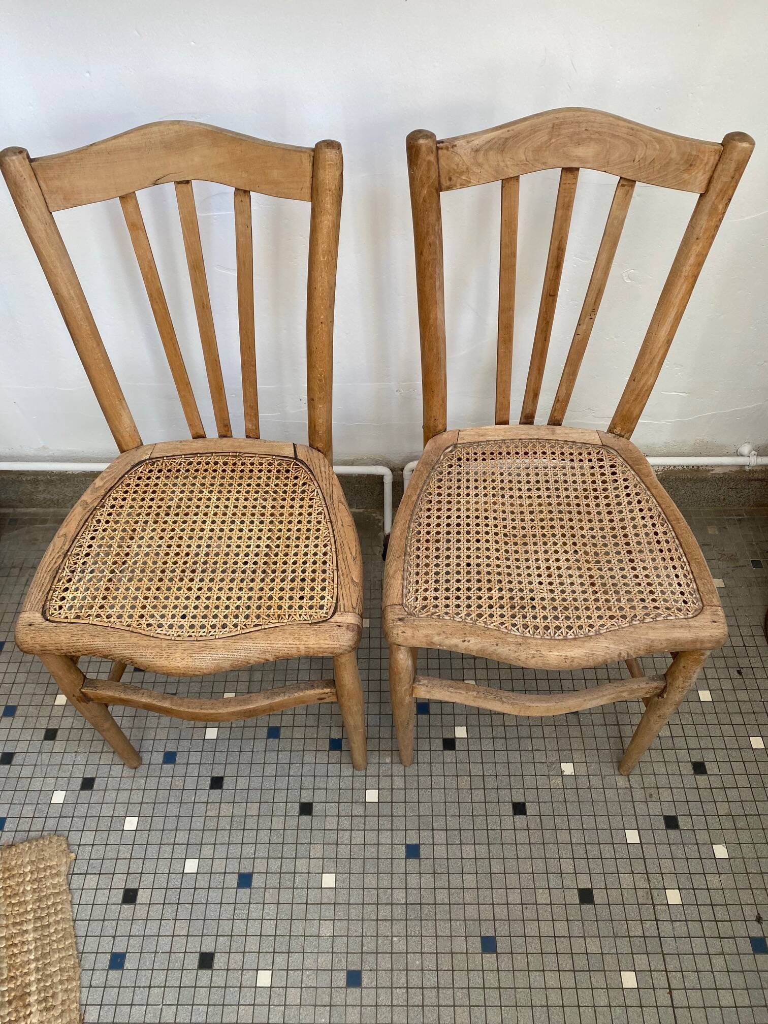 Pair of caned bistro chairs