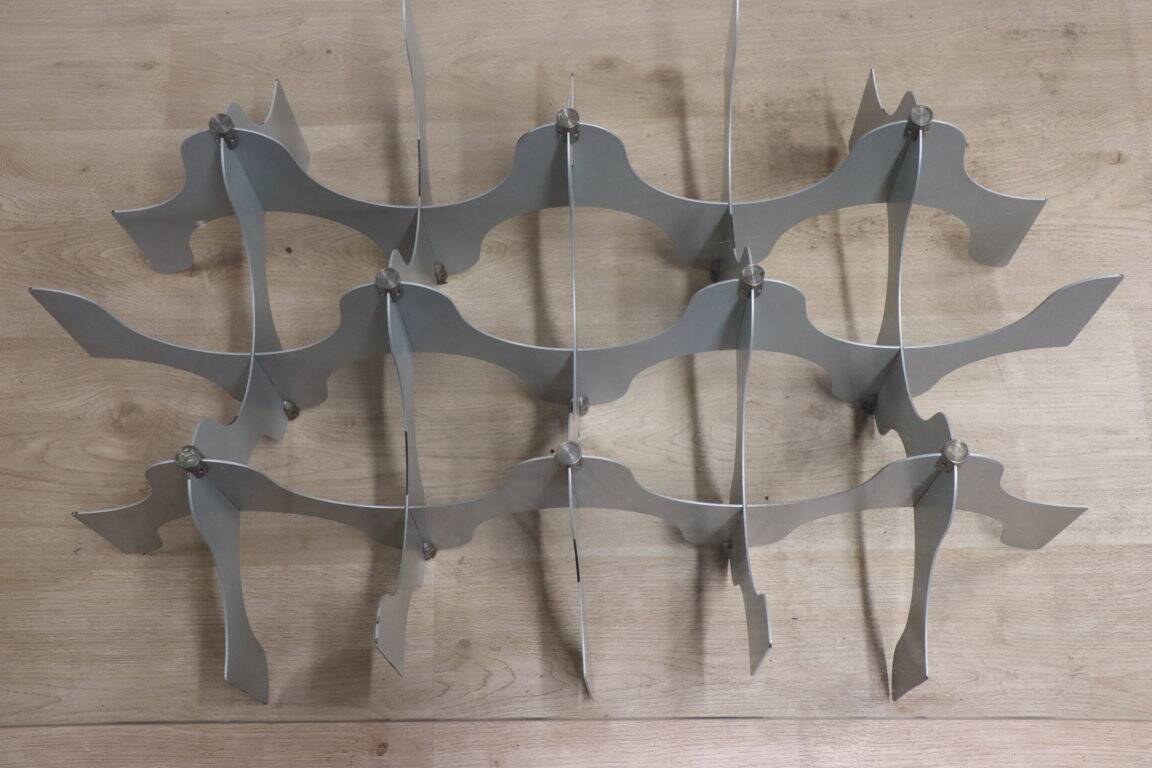 Minimalist sculptural coffee table in metal and glass