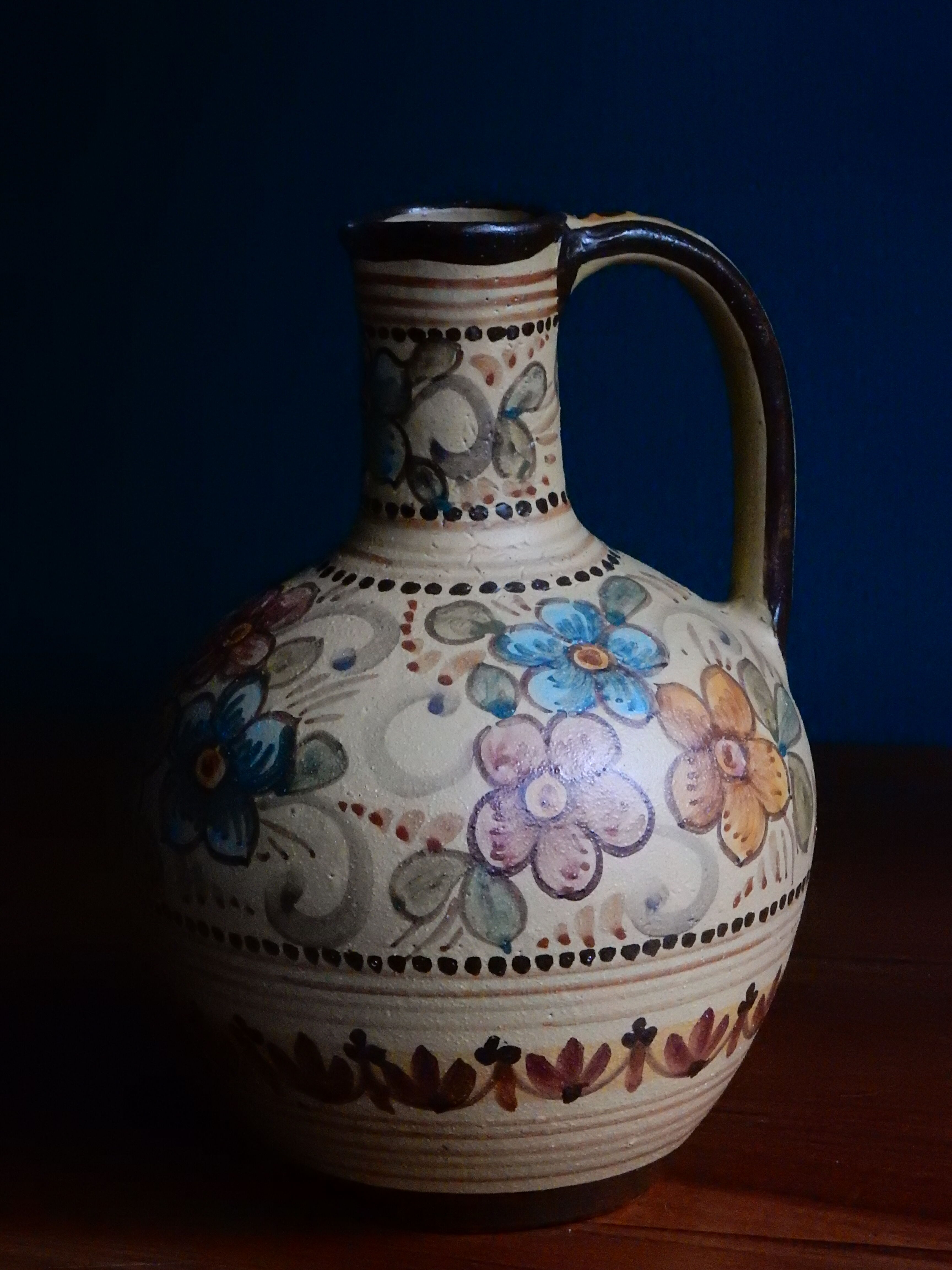 Hand-painted terracotta jug