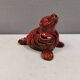 Beautiful seal in ceramic with metallic red glaze.