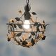 Patinated metal ceiling light with a floral and leaf pattern, 1950s, Italy.