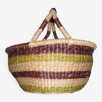 Round and colorful straw basket with handles