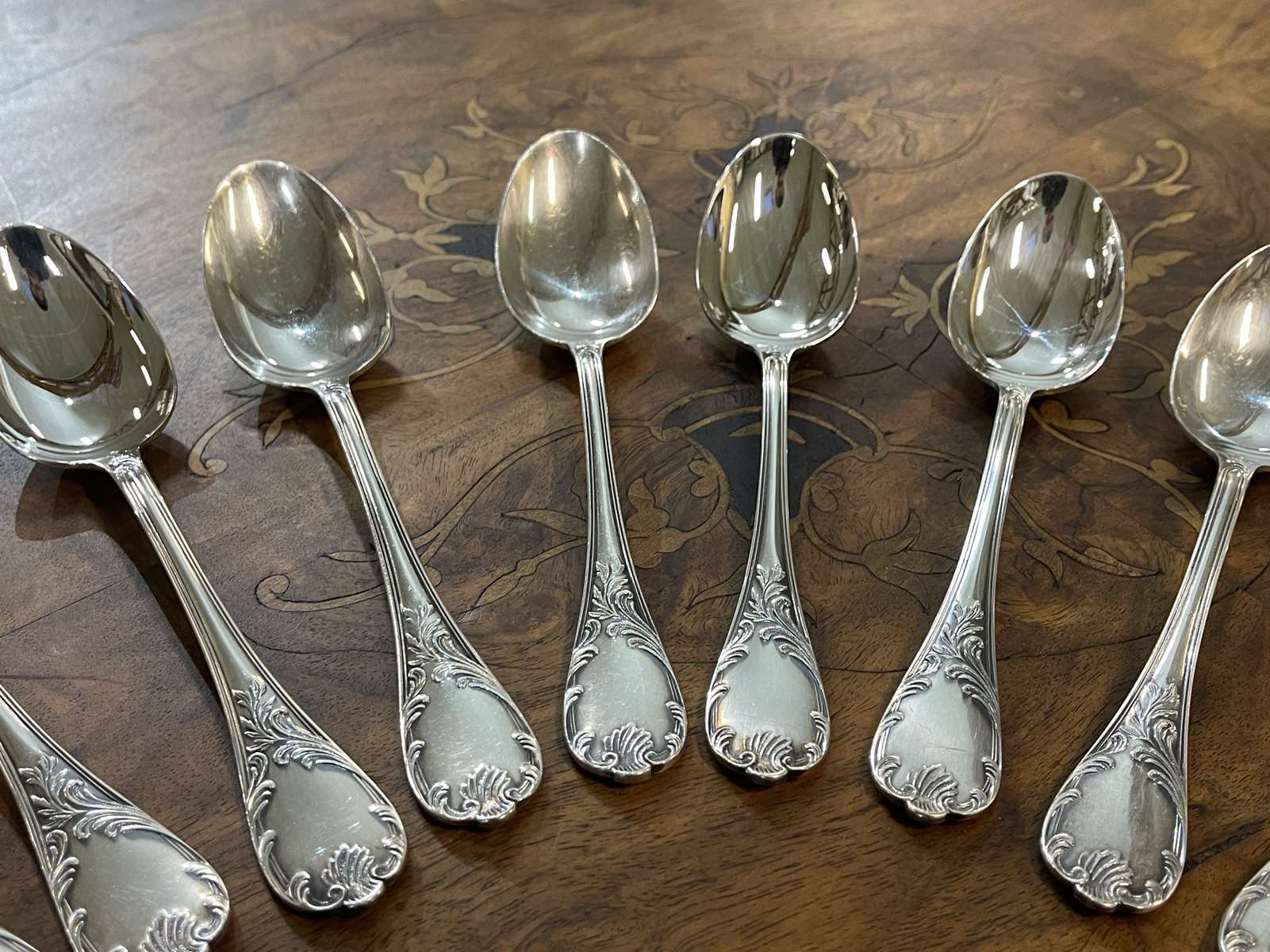 Series of 12 Christofle model Marly dessert spoons in silver metal