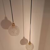 Two-light pendant in a cascade of cut crystal globe