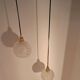 Two-light pendant in a cascade of cut crystal globe