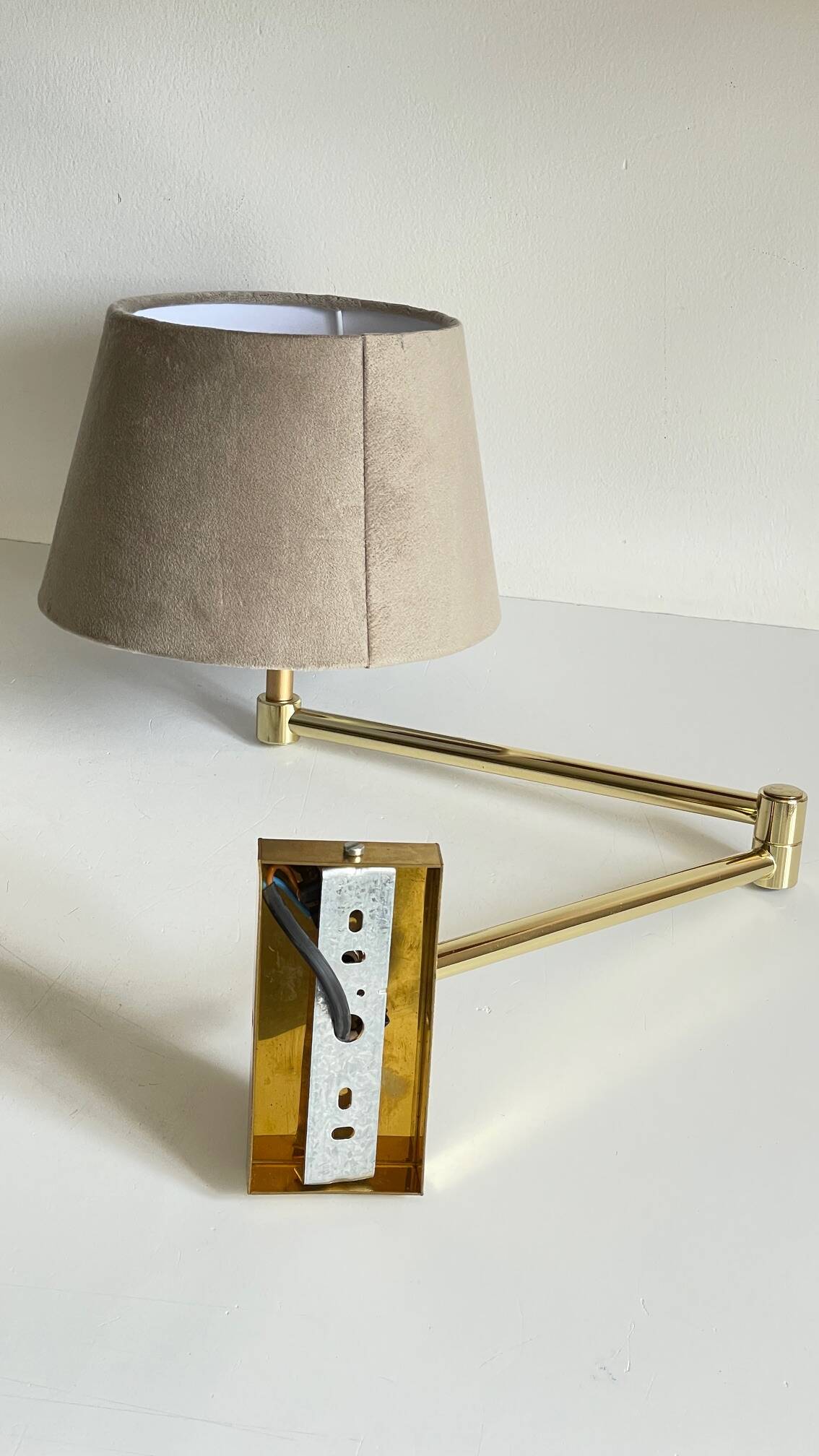 articulated brass and velvet wall light